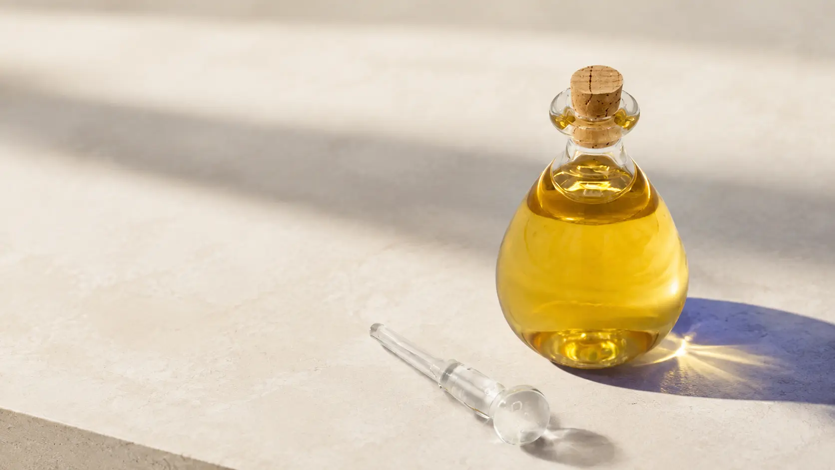 APO Hydrating Skin Regenerating Serum in a teardrop-shaped glass bottle with applicator